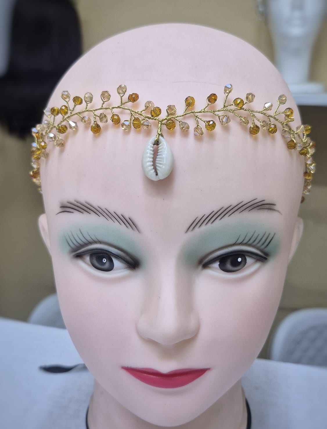 Brown and gold with dangling shell
